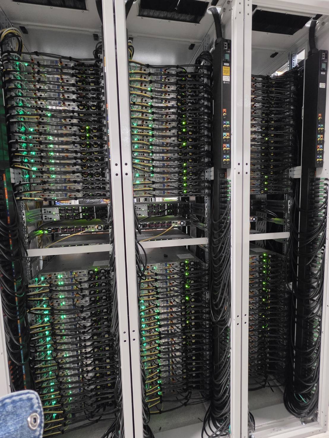 Dense compute racks after population, with power and data dressed per U