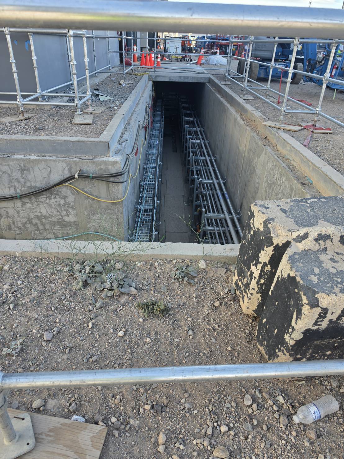 Open underground pathway at grade, tray and conduit ready for pull